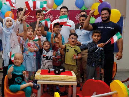 Iranian National Weightlifting Team's Exercise with MAHAK Children