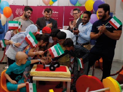 Iranian National Weightlifting Team's Exercise with MAHAK Children