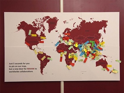 The world map at the booth of MAHAK by which visitors could express their interest in cooperating with MAHAK