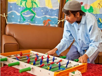 MAHAK child The playful boy playing table food and having fun