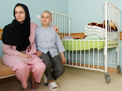 One of MAHAK children with his mom The child enjoying his mom's company in his room