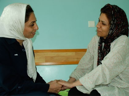Head of MAHAK social work dept with one of children's mom Head of social workers while consulting with one of mothers